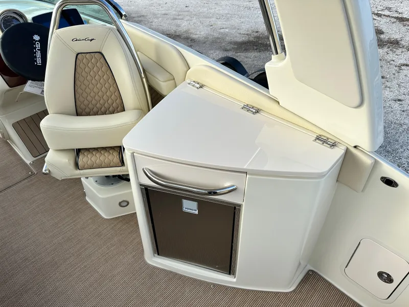 Slide: The Image of 2025 Chris-Craft Launch 28 GT interior with luxury seating and storage compartment. - 11