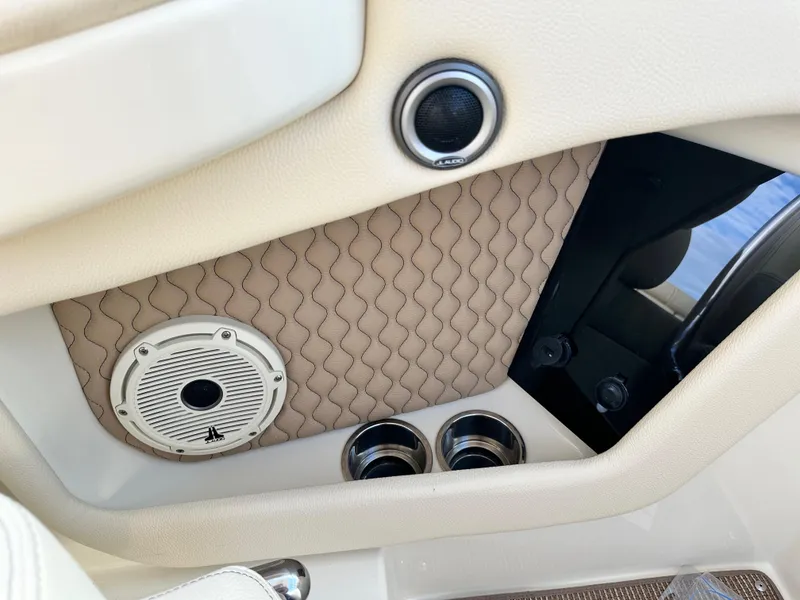 Slide: The Image of Interior detail of 2025 Chris-Craft Launch 28 GT, featuring speaker and quilted panel design. - 16