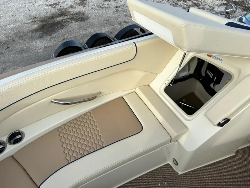 Slide: The Image of 2025 Chris-Craft Launch 28 GT interior with beige seating and storage compartment. - 23