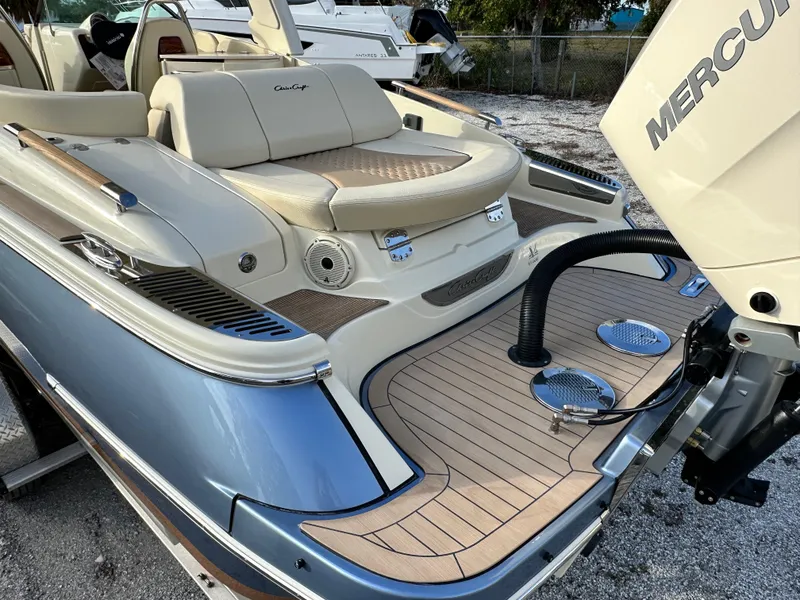 Slide: The Image of 2025 Chris-Craft Launch 28 GT boat with luxurious seating and Mercury engine. - 4