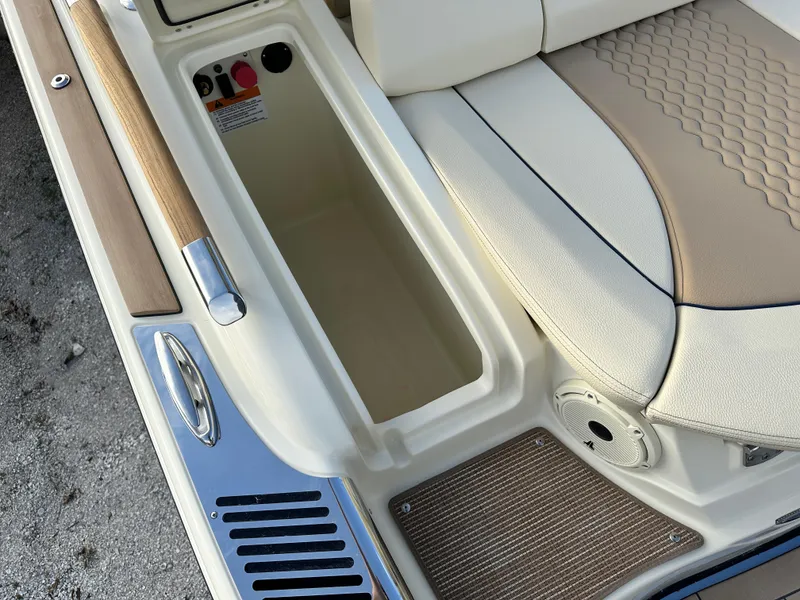 Slide: The Image of 2025 Chris-Craft Launch 28 GT boat interior, featuring storage compartment and luxurious seating. - 7