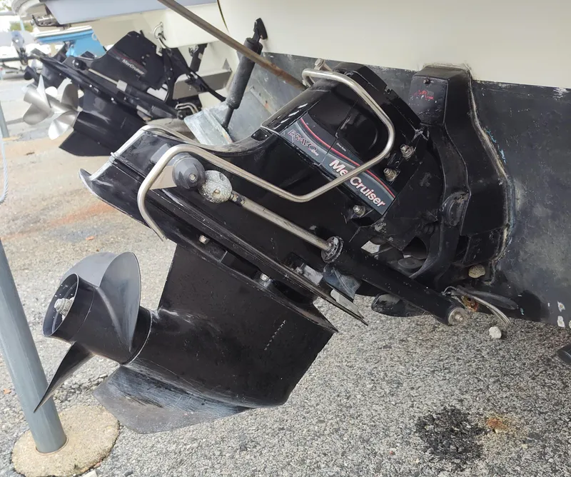 Slide: The Image of 1988 Sea Ray 268 DA boat with MerCruiser outdrive, displayed on a dry dock. - 10