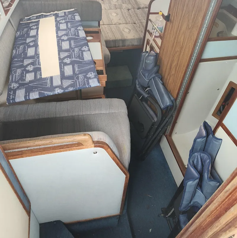Slide: The Image of Interior of 1988 Sea Ray 268 DA boat with seating and table setup. - 9