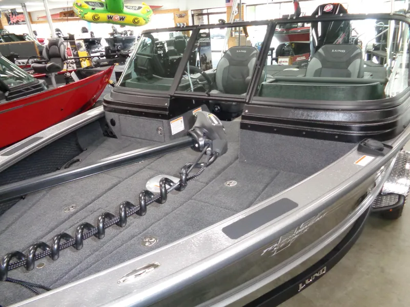 Slide: The Image of 2025 Lund 1875 Pro-V Sport boat interior with seating and equipment. - 10