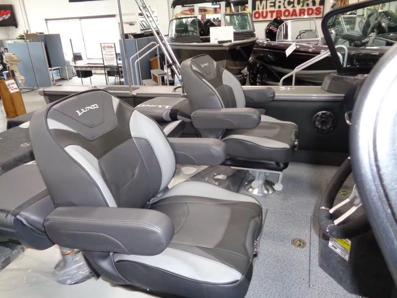 Slide: The Image of 2025 Lund 1875 Pro-V Sport boat interior with comfortable seating and modern design. - 14