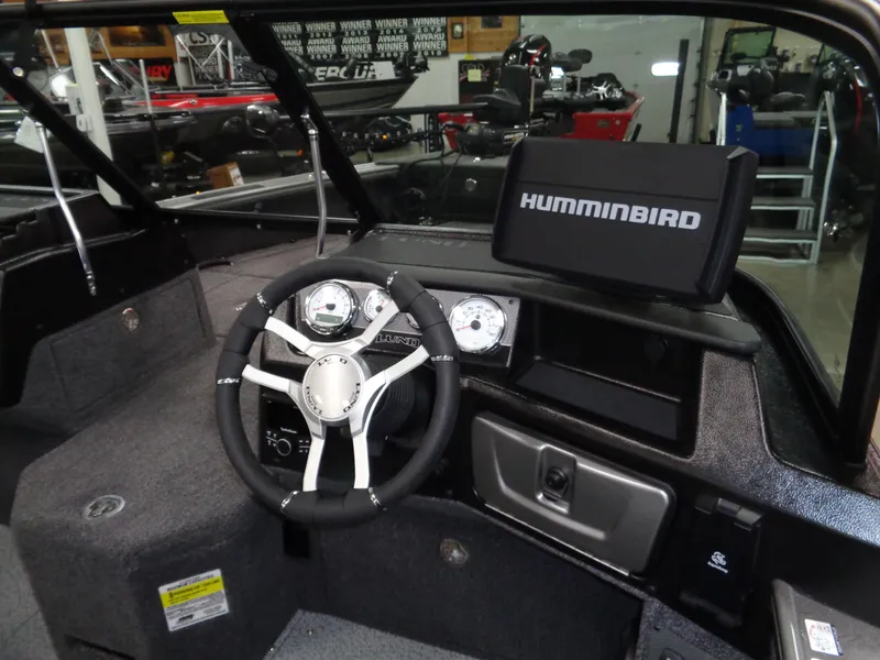 Slide: The Image of 2025 Lund 1875 Pro-V Sport boat dashboard with Humminbird navigation system. - 15