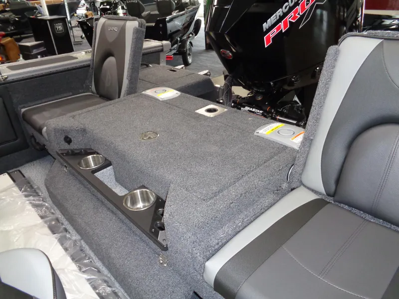 Slide: The Image of 2025 Lund 1875 Pro-V Sport boat interior with seating and cup holders. - 18