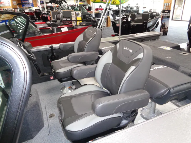 Slide: The Image of 2025 Lund 1875 Pro-V Sport boat interior with comfortable seating and modern design. - 9