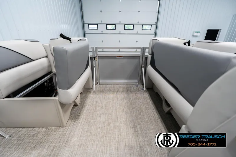 Slide: The Image of Interior of 2025 Avalon VEN RF boat with gray seating and carpeted flooring. - 19