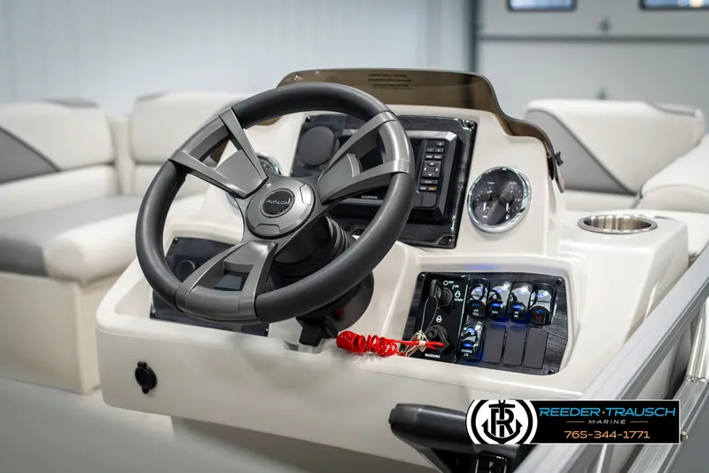 Slide: The Image of 2025 Avalon VEN RF boat dashboard with steering wheel and control panel. - 28