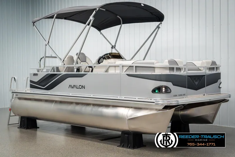 Slide: The Image of 2025 Avalon VEN RF pontoon boat with canopy, displayed indoors. - 3