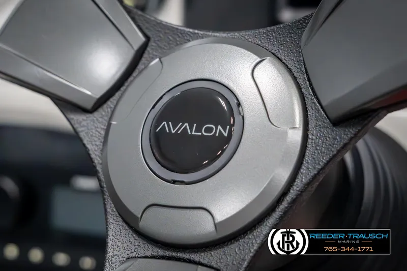 Slide: The Image of Steering wheel of 2025 Avalon VEN RF boat, featuring sleek design and logo. - 30