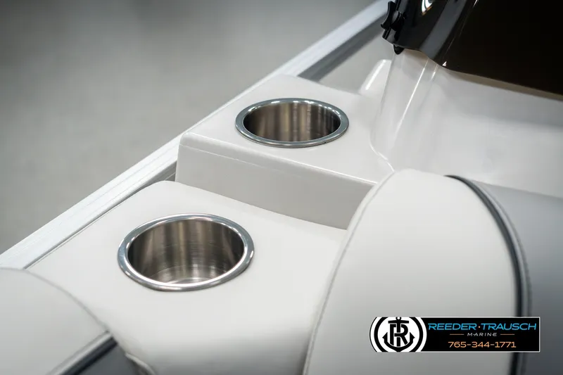 Slide: The Image of 2025 Avalon VEN RF boat interior with stainless steel cup holders and sleek design. - 40