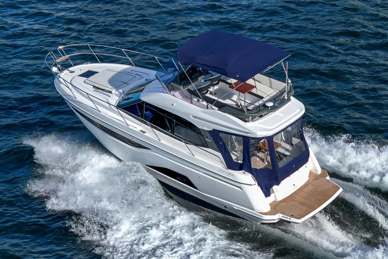 Slide: The Image of 2024 Bavaria R40 yacht cruising on open water, featuring sleek design and spacious deck. - 12