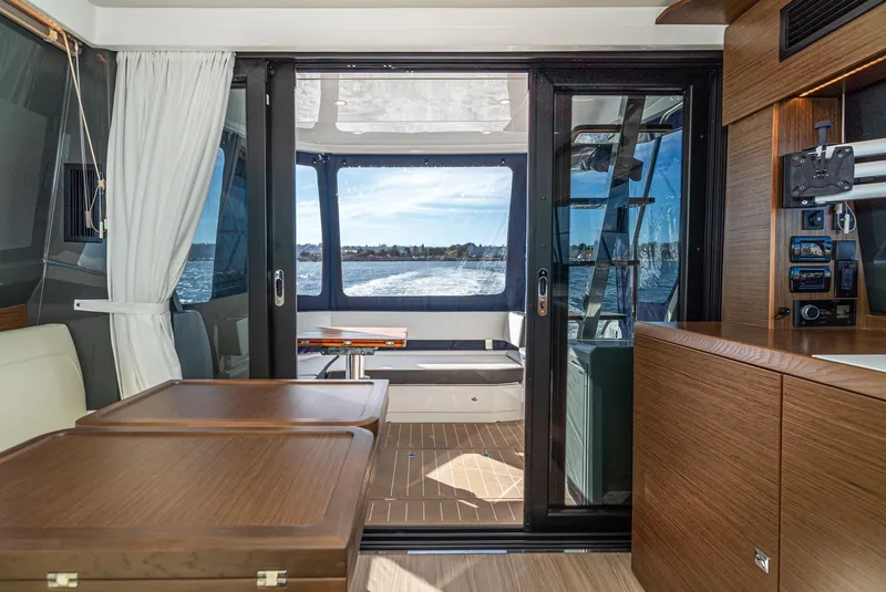 Slide: The Image of Luxurious interior of 2024 Bavaria R40 yacht with modern wood finishes and ocean view. - 44