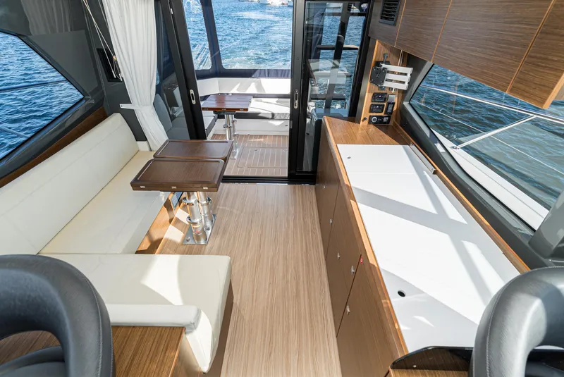 Slide: The Image of Luxurious interior of 2024 Bavaria R40 yacht with modern seating and wooden finishes. - 47