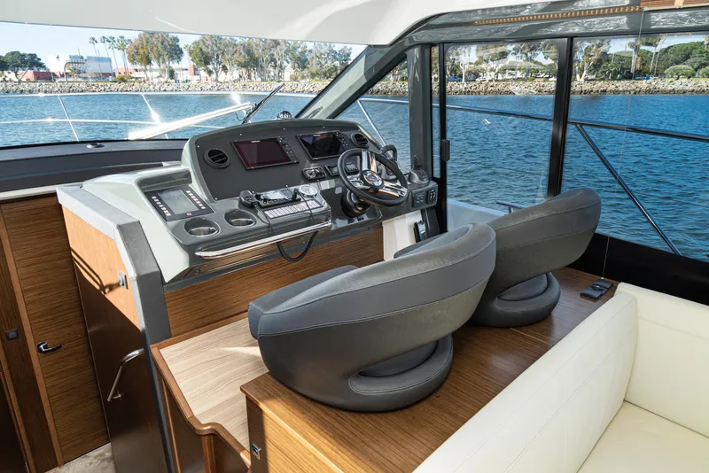 Slide: The Image of Interior helm of 2024 Bavaria R40 yacht with modern controls and dual seating. - 48