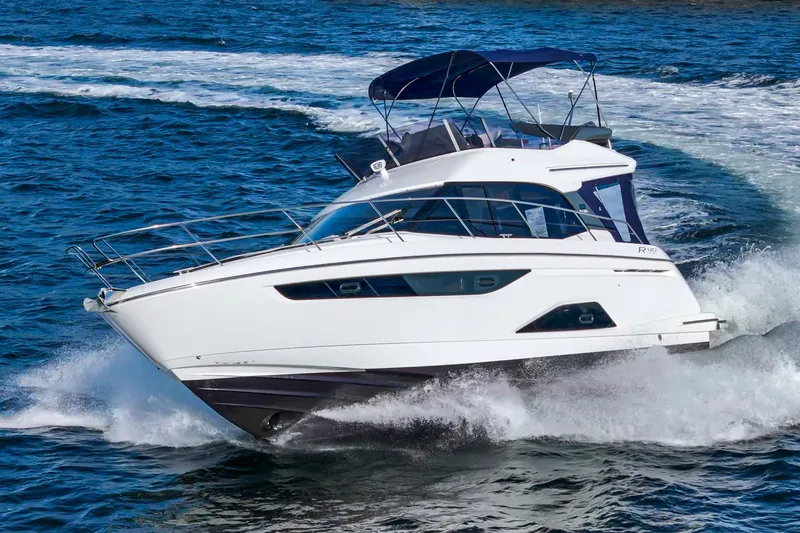 Slide: The Image of 2024 Bavaria R40 yacht cruising on open water. - 5