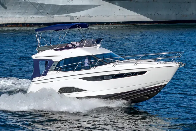 Slide: The Image of 2024 Bavaria R40 yacht cruising on open water. - 9