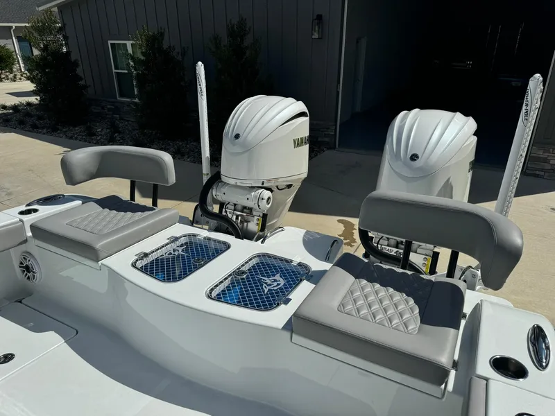 Slide: The Image of 2024 Freeman 28 boat with Yamaha engines and cushioned seating. - 14
