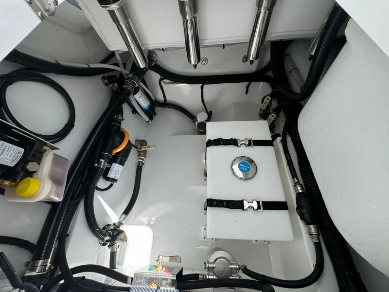 Slide: The Image of 2024 Freeman 28 engine compartment with cables, hoses, and components. - 16