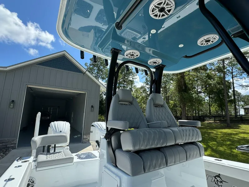 Slide: The Image of 2024 Freeman 28 boat interior with plush seating and modern design. - 25