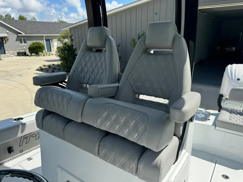 Slide: The Image of Freeman 28 boat seats, 2024 model, featuring luxurious gray leather upholstery. - 26