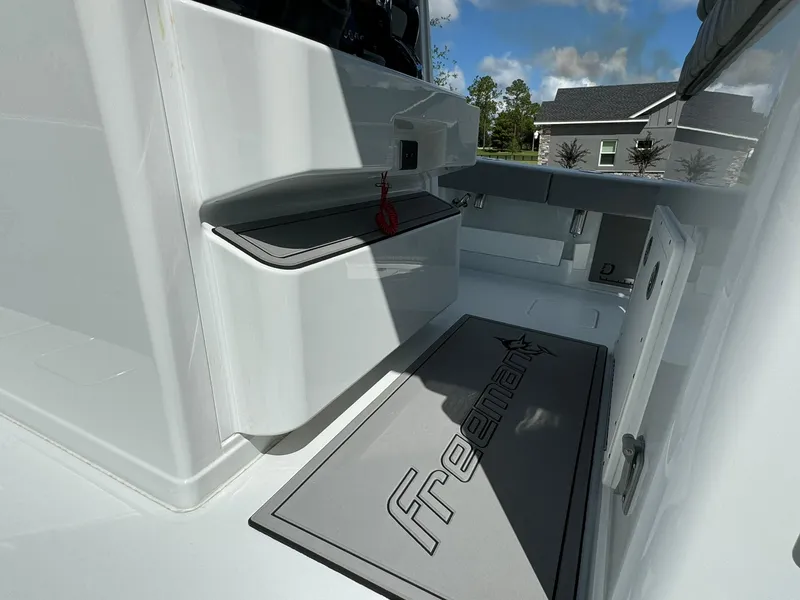 Slide: The Image of 2024 Freeman 28 boat interior with sleek design and branded mat. - 33