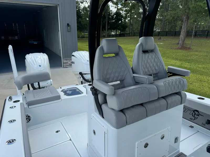 Slide: The Image of 2024 Freeman 28 boat interior with gray cushioned seats and modern design. - 35