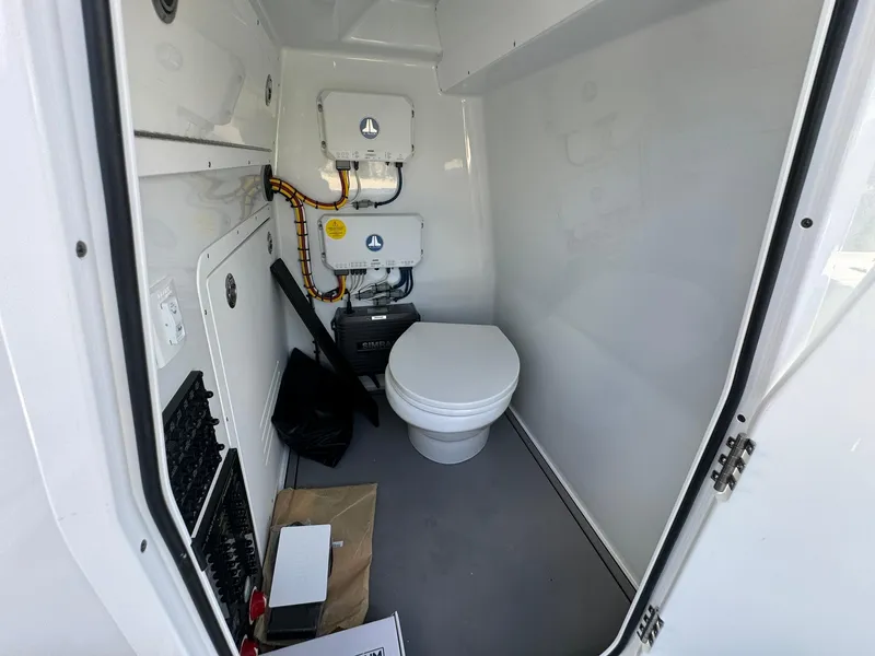 Slide: The Image of Freeman 28 boat interior bathroom with modern toilet, 2024 model. - 36