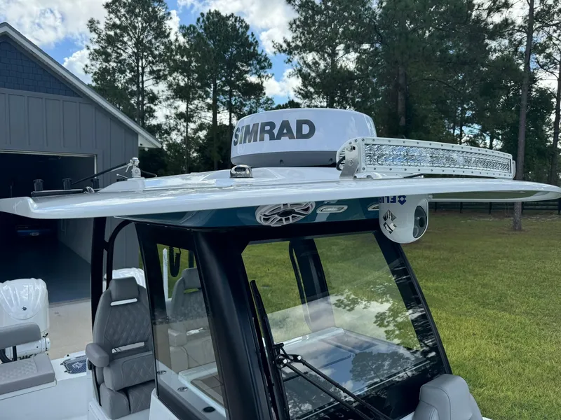 Slide: The Image of 2024 Freeman 28 boat with Simrad radar and LED light bar on roof. - 38