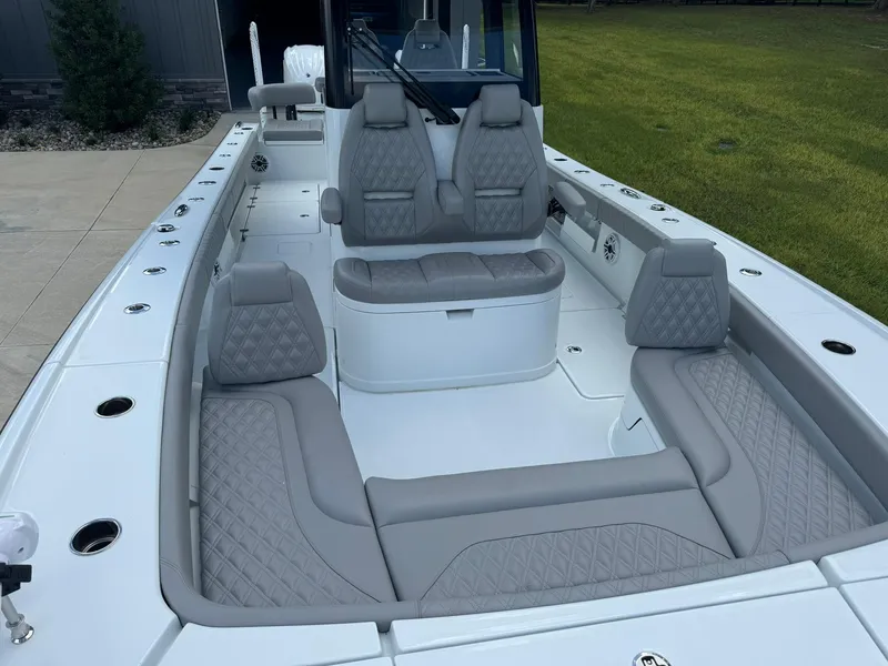 Slide: The Image of 2024 Freeman 28 boat with luxurious gray seating and spacious deck layout. - 43