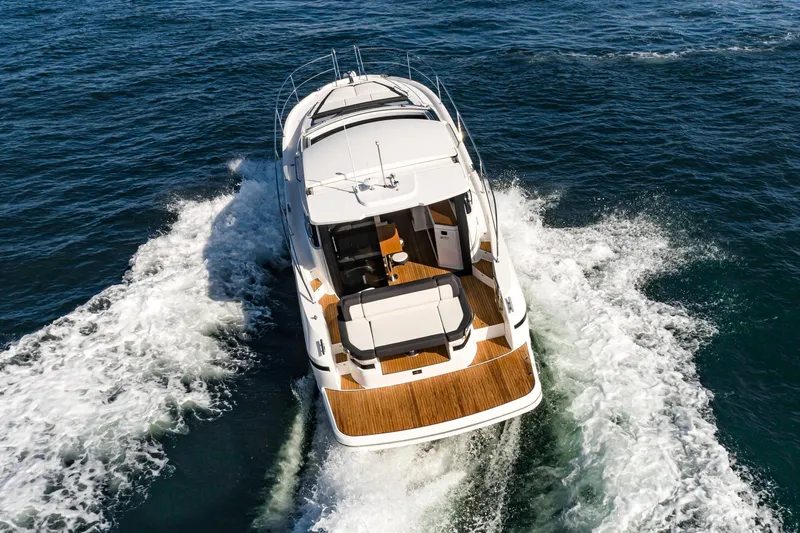 Slide: The Image of 2024 Bavaria SR41 yacht cruising on open water, aerial view. - 11