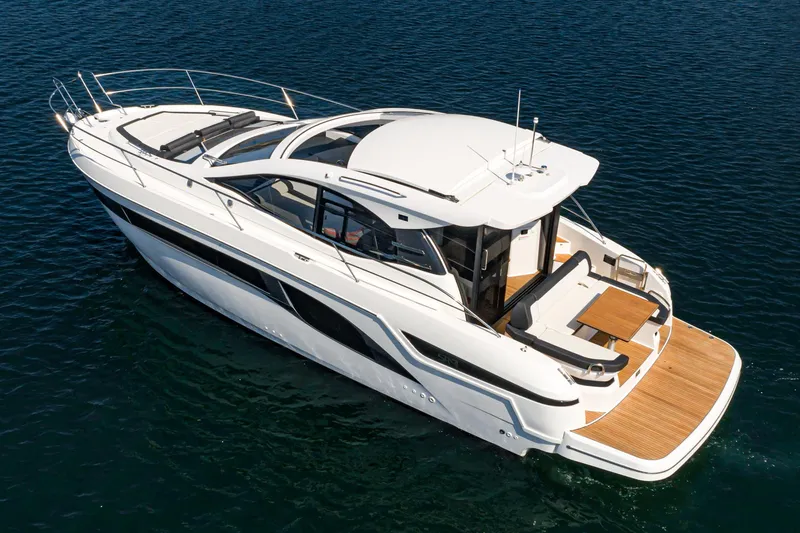Slide: The Image of 2024 Bavaria SR41 yacht cruising on open water, showcasing sleek design and luxury features. - 13