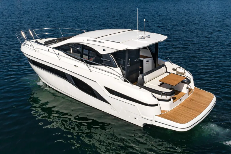 Slide: The Image of 2024 Bavaria SR41 yacht cruising on open water, showcasing sleek design and spacious deck. - 14