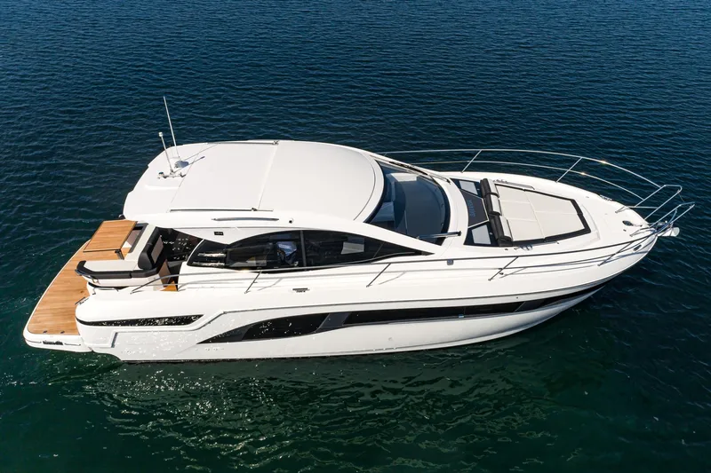 Slide: The Image of 2024 Bavaria SR41 yacht cruising on calm blue waters. - 15