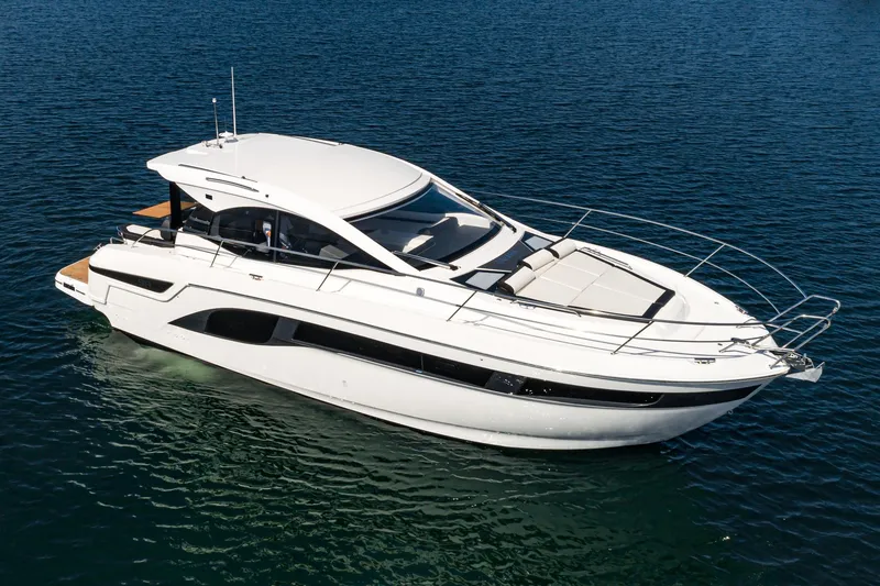 Slide: The Image of 2024 Bavaria SR41 yacht cruising on calm blue waters. - 18