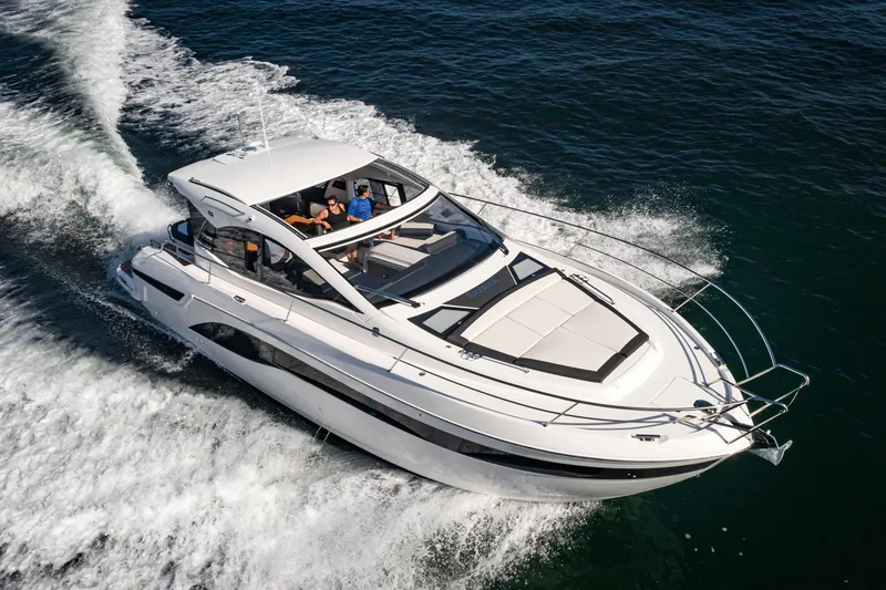 Slide: The Image of 2024 Bavaria SR41 yacht cruising on open water, showcasing sleek design and luxury features. - 2
