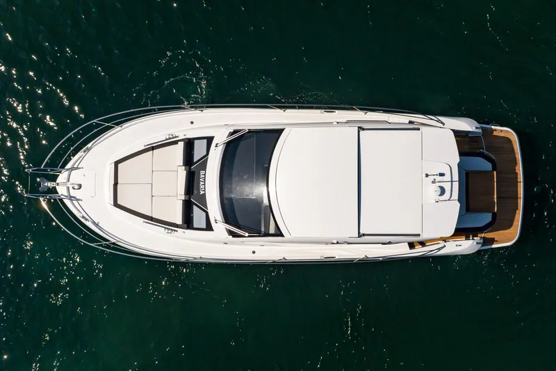 Slide: The Image of Top view of 2024 Bavaria SR41 yacht on open water. - 22