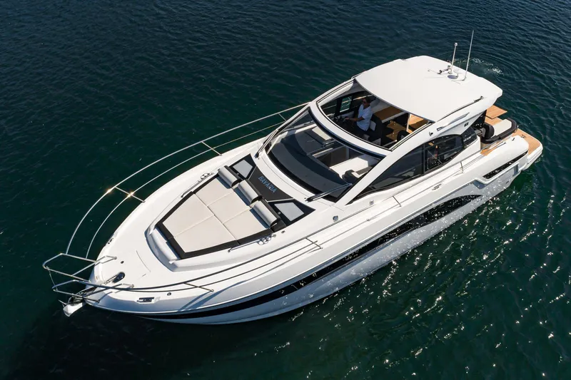 Slide: The Image of 2024 Bavaria SR41 yacht cruising on clear blue water. - 23