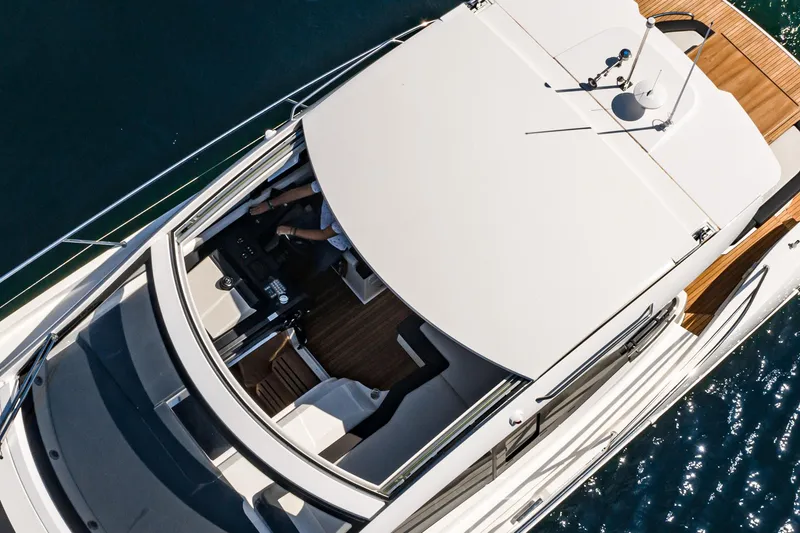 Slide: The Image of 2024 Bavaria SR41 yacht, aerial view, sleek design, cruising on blue water. - 24