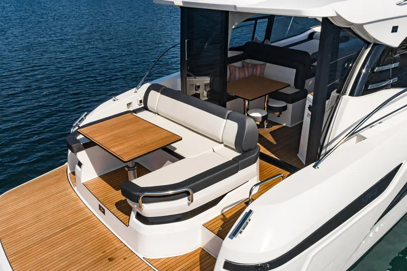 Slide: The Image of 2024 Bavaria SR41 yacht with elegant seating and dining area on deck. - 31