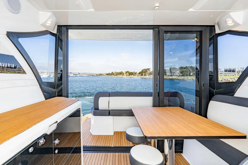Slide: The Image of Interior of 2024 Bavaria SR41 yacht with modern seating and scenic ocean view. - 39
