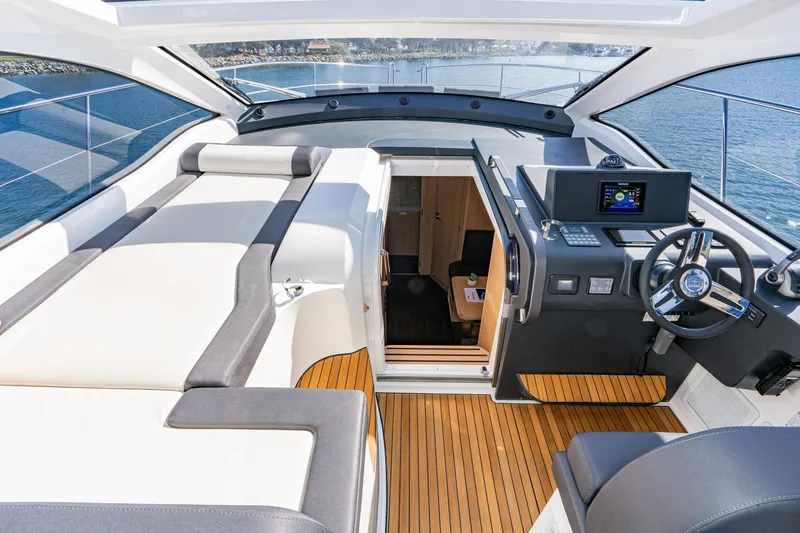 Slide: The Image of Luxurious 2024 Bavaria SR41 yacht interior with modern helm and spacious seating. - 45