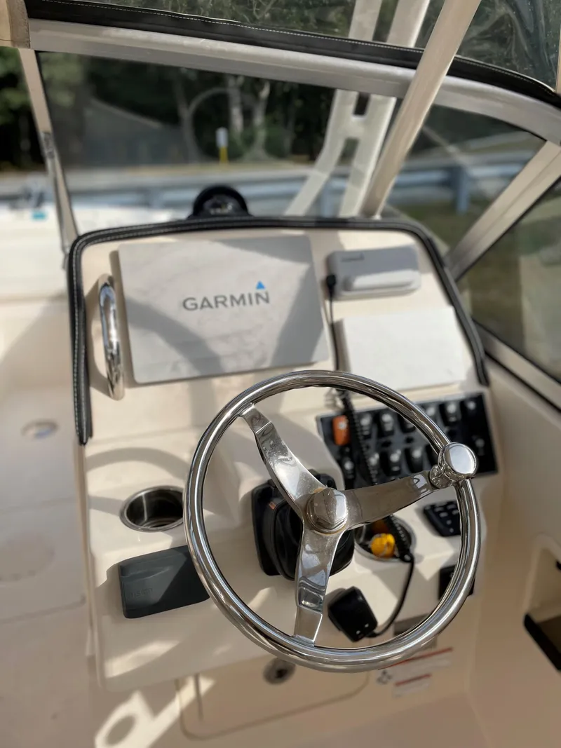 Slide: The Image of 2019 Grady-White 235 Freedom boat helm with Garmin navigation system. - 7