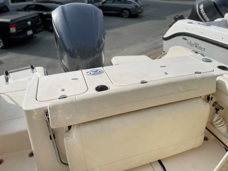 Slide: The Image of 2019 Grady-White 235 Freedom boat with outboard motor, docked in a marina. - 9