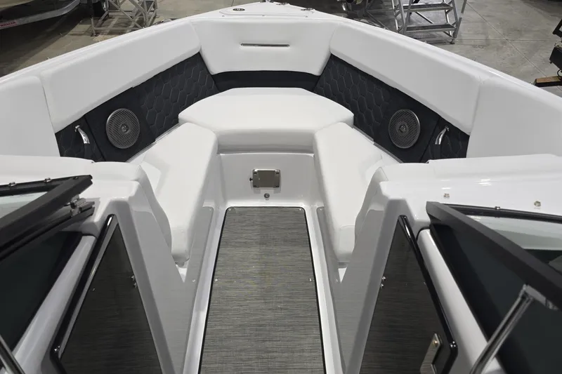 Slide: The Image of 2025 Four Winns H2 OB boat interior with cushioned seating and integrated speakers. - 11
