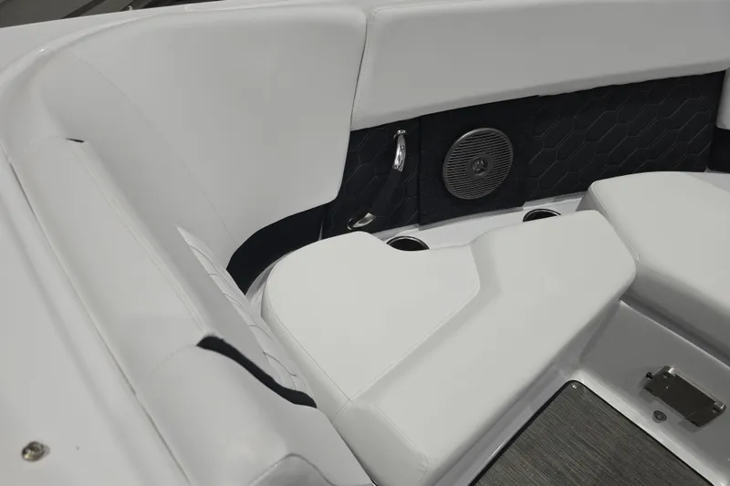 Slide: The Image of 2025 Four Winns H2 OB boat interior with white seating and speaker. - 13