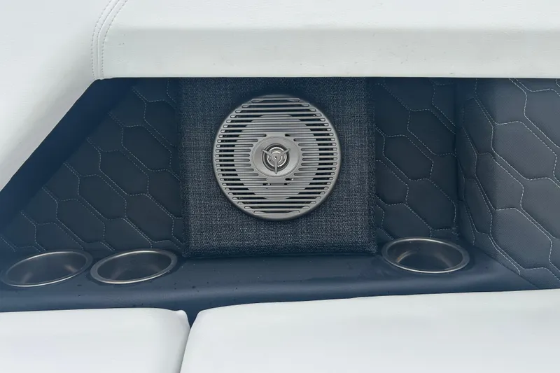 Slide: The Image of 2025 Four Winns H2 OB boat interior with speaker and cup holders. - 18