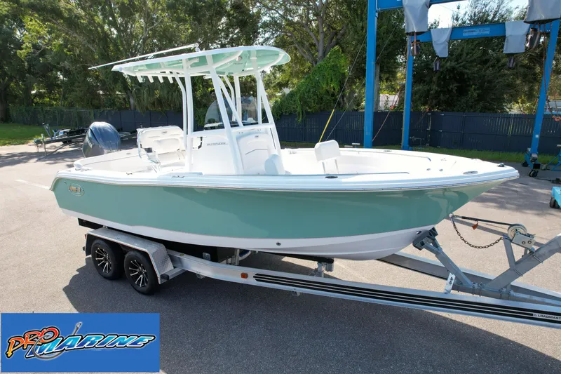 Slide: The Image of 2025 Sea Hunt Ultra 219 boat on trailer at Pro Marine dealership. - 12